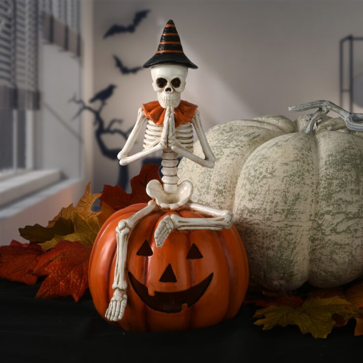 Image for 12" Skeleton Sitting on Pumpkin