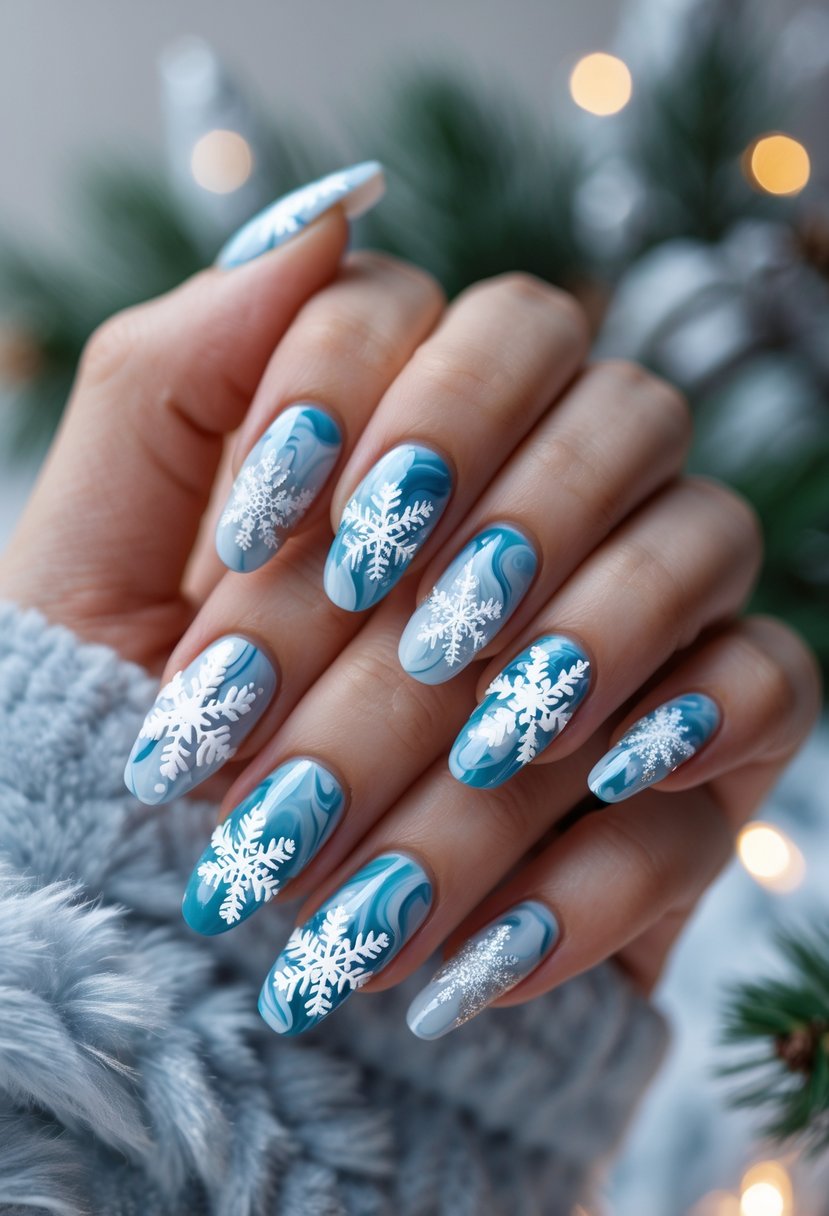 Close-up of a hand with 16 nails painted in blue and white marble patterns with snowflake designs.