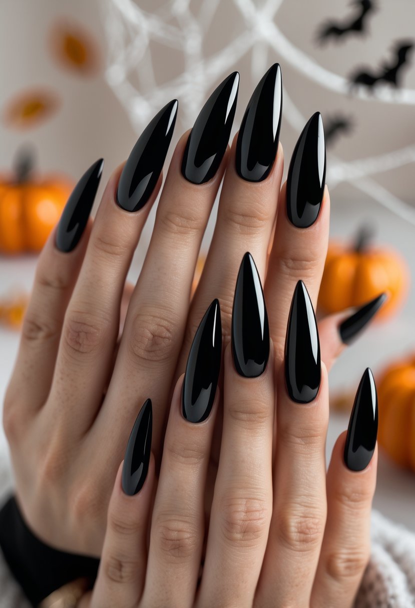 Close-up of hands with long, glossy black stiletto nails against a soft background with subtle Halloween decorations.