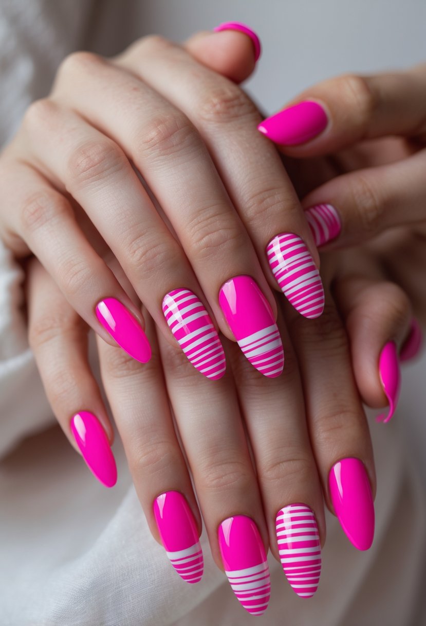 Close-up of hands with pink nails featuring candy cane striped designs.