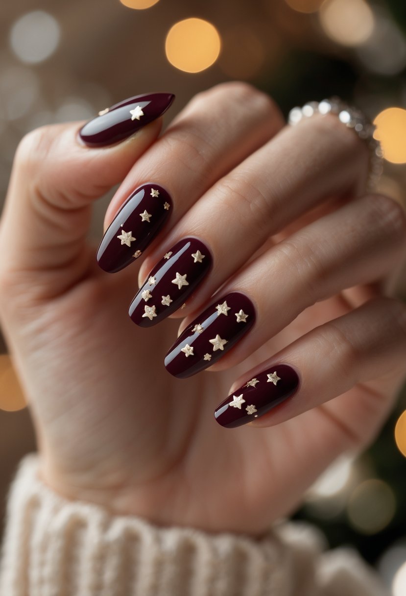 Close-up of hands with dark burgundy nails decorated with small star accents.