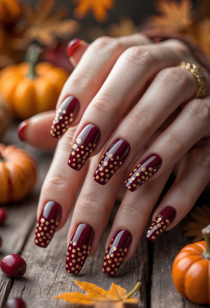 A close-up of a hand with 18 nails decorated with red dot patterns resembling cranberry sauce, set against a warm autumn background.