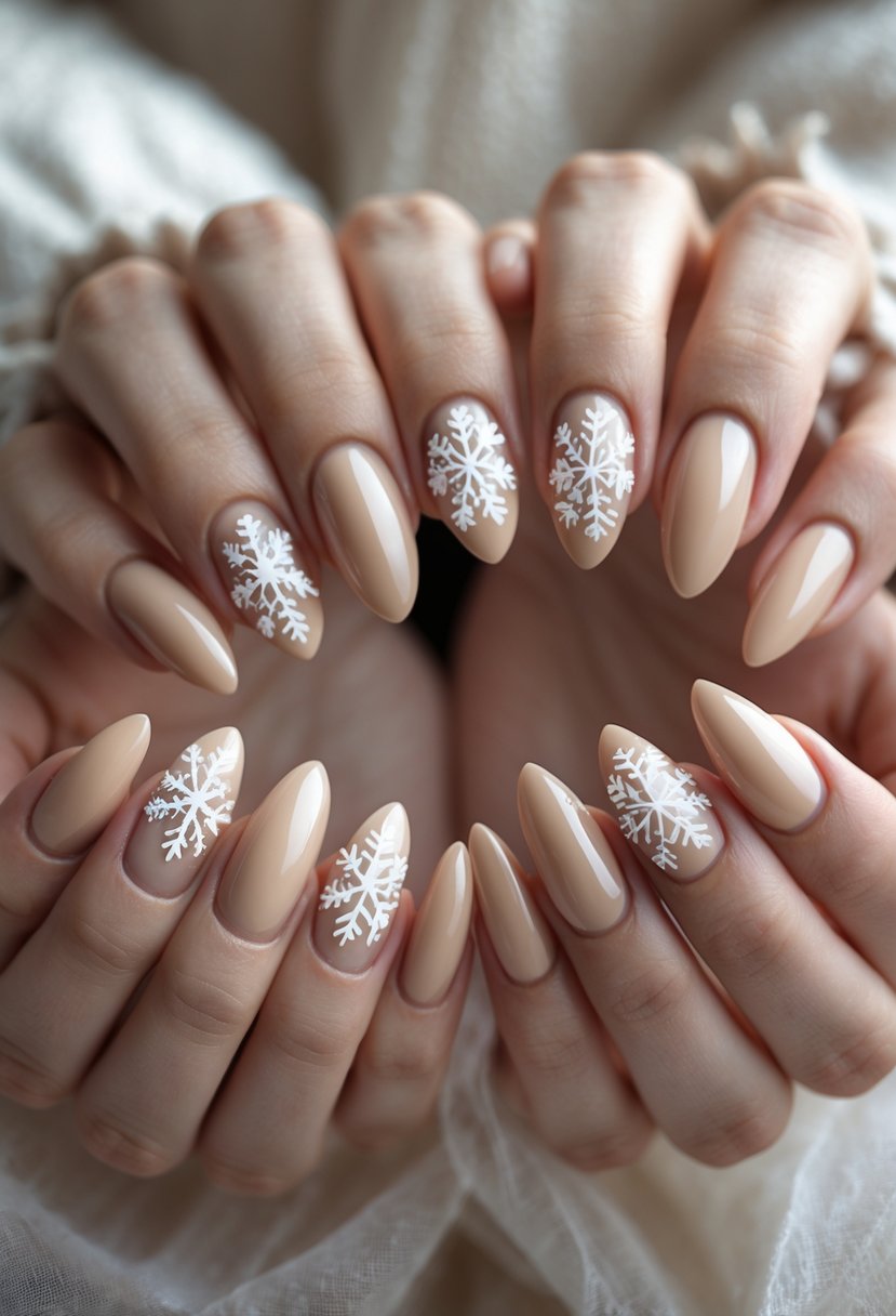 Close-up of hands showing almond-shaped nails painted almond color with white snowflake designs.