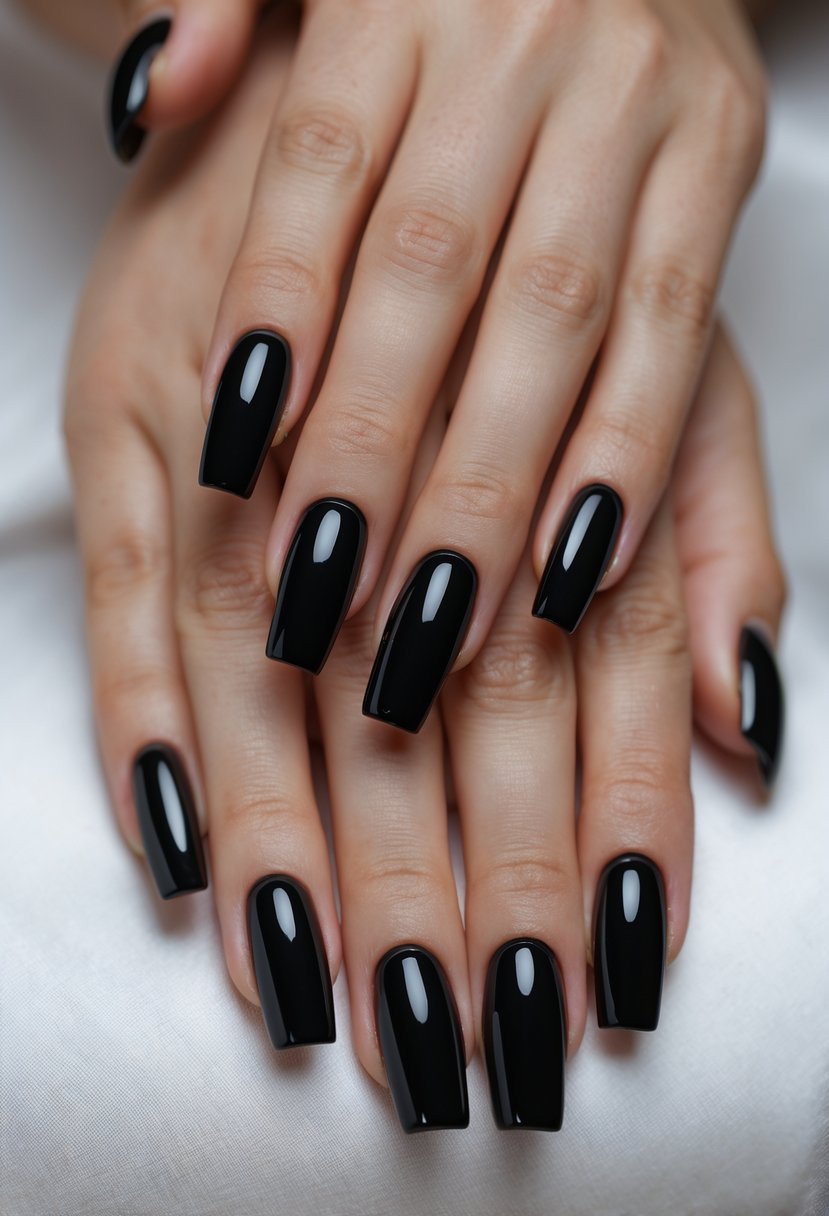 Close-up of hands with glossy black acrylic nails against a neutral background.