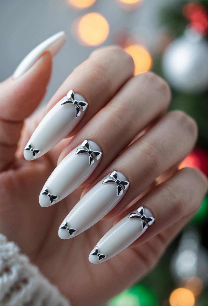 A hand with white painted nails decorated with small silver bows resembling gift wrap accents.