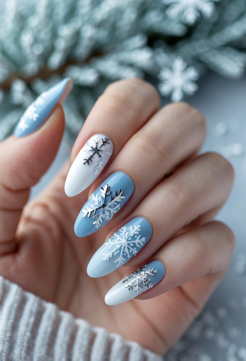 Close-up of a hand with winter-themed nails featuring snowflake designs and soft blue and white colors.